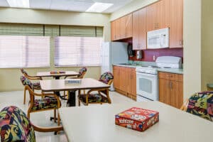 Activity/dining room with tables, chairs, and games on the tables.