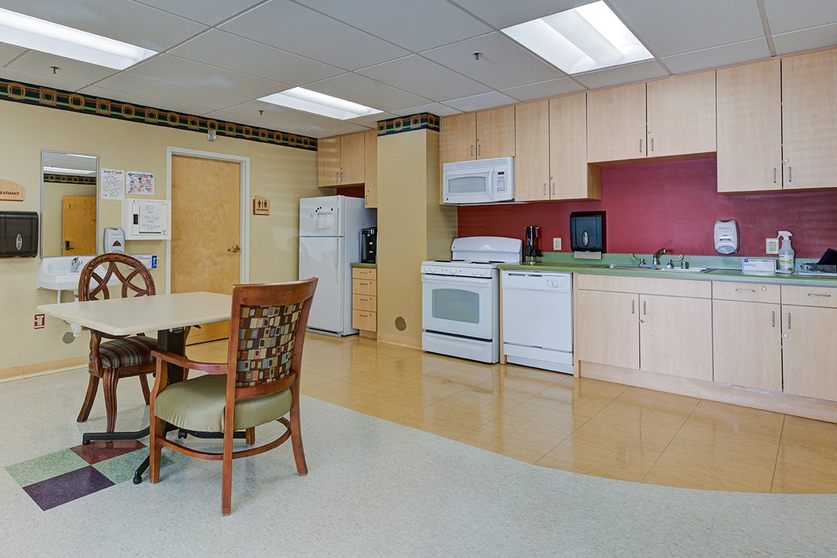 Kitchenette area with table and chairs.