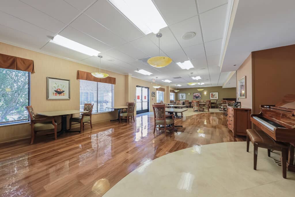 rossmoor post acute gathering room with piano